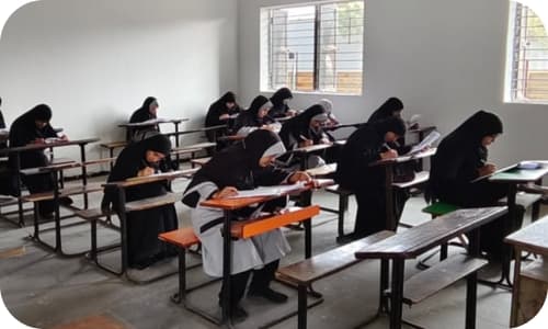 Students writing an exam in a classroom